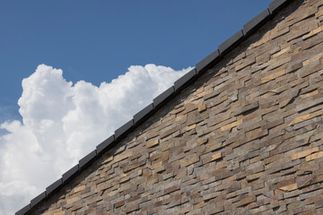 Fototapeta na wymiar modern architecture detail, stone brick with sky