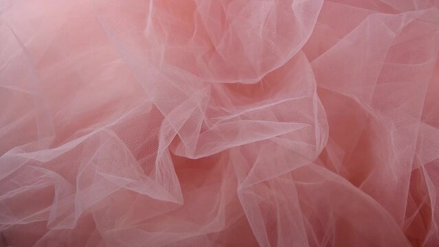 Pink tulle material background, pastel colors, romantic and delicate drapery
