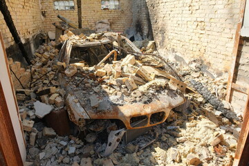 Destroyed car of civilians in the Irpin garage at Ukraine. War in Ukraine