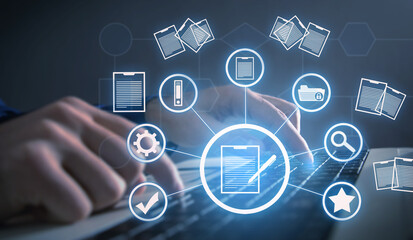 Businessman using a computer keyboard. Online documentation database