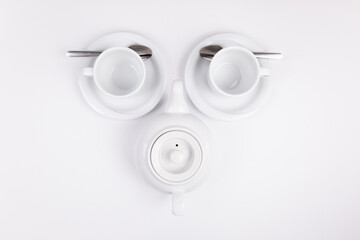 Obraz na płótnie Canvas white porcelain teapot and cup on saucer for coffee or tea empty
