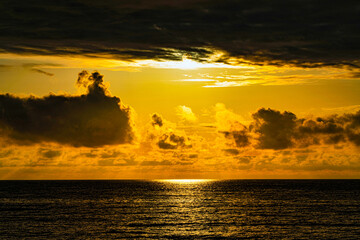 the sun breaks through the clouds, a beautiful seascape