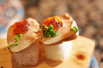 monkfish liver Sushi  on a cutting board