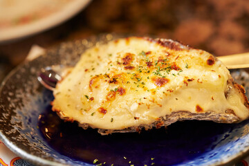 Grilled Butter Cheese Oysters on a Plate