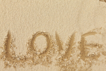 'love' word on the sandy beach