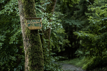 french sign in a woodland area