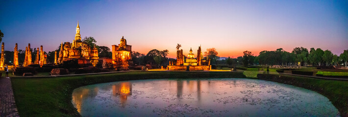 Sunset at Wat Mahathat buddha and temple in Sukhothai Historical Park