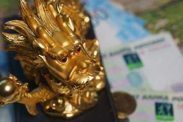 Dragon figurine close-up. Financial well-being. A positive symbol of feng shui.