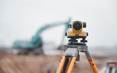 Theodolite or geodetic total positioning station is surveyors equipment on the construction site of...