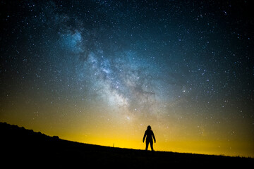 Milky way and girl in Serra Del Montsec, Lleida, Spain