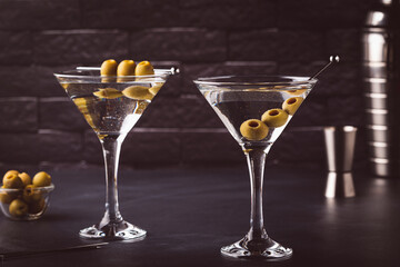 Martini cocktail on dark stone table.