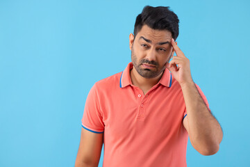 Fototapeta premium Portrait of a sick young man suffering from headache