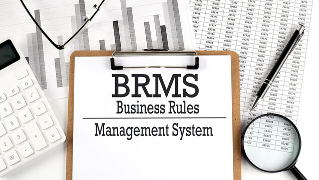 Paper with BRMS - Business Rules Management System table on charts, business concept