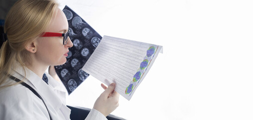 Epileptologist examines patient MRI and electroencephalogram. Concept treating epilepsy and helping...