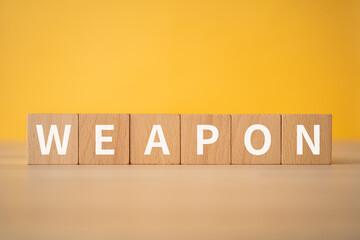 武器のイメージ｜「WEAPON」と書かれた積み木