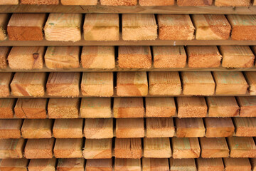 Stacks of wooden planks and boards. Timber and lumber, woodworking background
