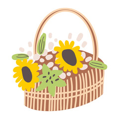 A wicker basket with fresh flowers. Composition of sunflowers in a straw box with a handle