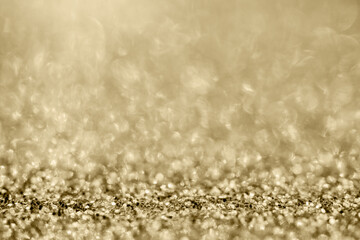 Abstract gold glitter sparkle blurred with bokeh background