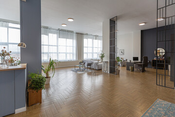 minimalist modern interior design huge bright apartment with an open plan in Scandinavian style in white, blue and dark blue colors with columns in the center. includes kitchen area, office and lounge