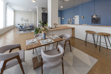minimalist modern interior design huge bright apartment with an open plan in Scandinavian style in white, blue and dark blue colors with columns in the center. includes kitchen area, office and lounge