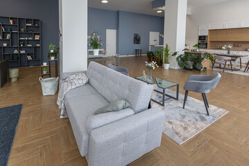 minimalist modern interior design huge bright apartment with an open plan in Scandinavian style in white, blue and dark blue colors with columns in the center. includes kitchen area, office and lounge