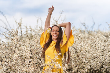 Beautiful woman in a blackthorn bush