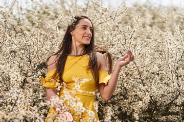 Beautiful woman in a blackthorn bush
