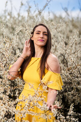 Beautiful woman in a blackthorn bush