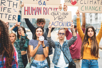 Group of multiethnic people making protest about climate change, public demonstration on the street against global warming and pollution. - obrazy, fototapety, plakaty