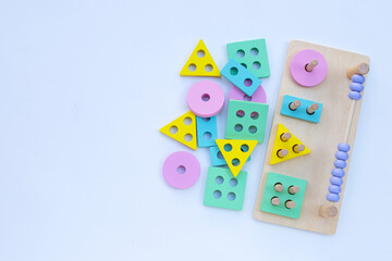 Colorful wooden toys for children on white background.