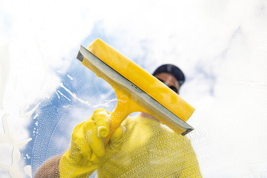 cleaning window with squeegee. Cleaning conept image.