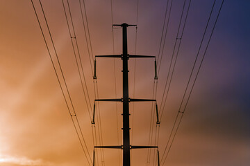 Electricity pylon against the sky. High - voltage power lines .