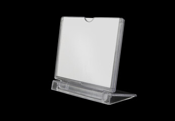 Plastic desk display isolated on black.