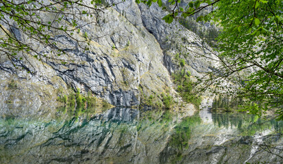 Fototapeta na wymiar reflections on the water surface, Obersee, Bavaria
