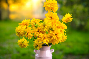 beautiful big bouquet of yellow flowers. pick flowers in the garden. Good morning on a sunny day in the garden. Greeting card with natural flower background. 