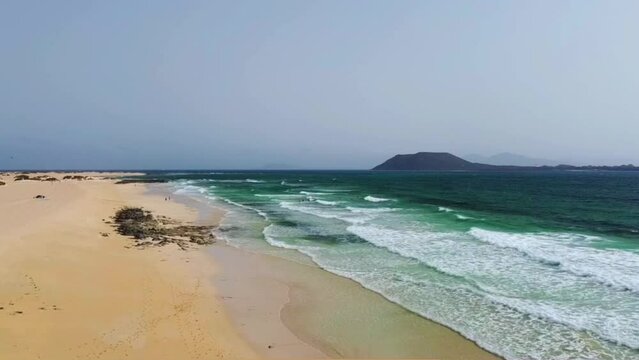 Flying above a surf beach in fuerteventura