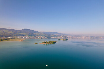 Aerial view from City of Rapperswil-Jona with Lake Z&uuml;rich and two islands on a sunny spring day. Photo taken April 28th, 2022, Raperswil-Jona, Canton St. Gallen, Switzerland.