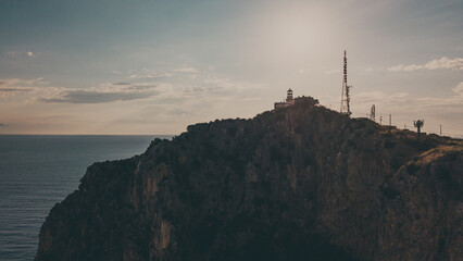 Lighthouse of Capo Palinuro at sunset with a view of the deep blue sea