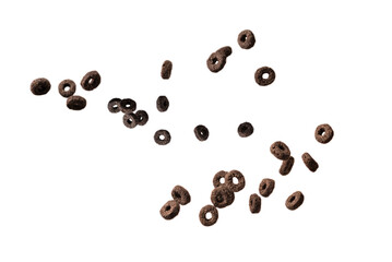 Chocolate rings cereal spill out into a bowl. Breakfast.