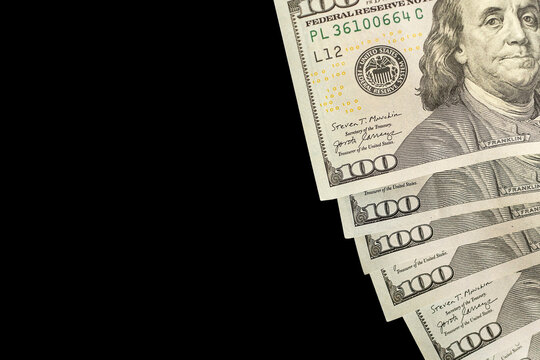 Pile of American dollars isolated on black.