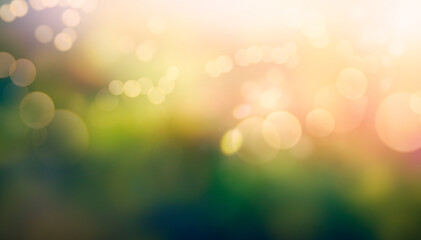 A summer sunset, sunrise background with lush green foliage and orange glow sky with blurred spring bokeh highlights. - obrazy, fototapety, plakaty