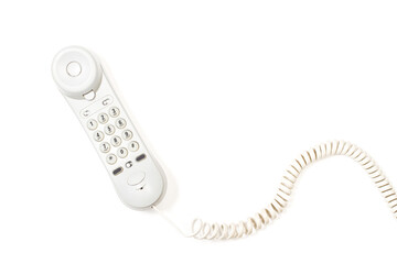 Tubo de teléfono con cable sobre un fondo blanco liso y aislado. Vista superior. Copy space - obrazy, fototapety, plakaty