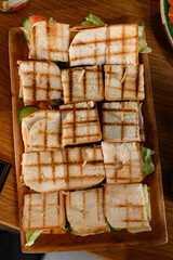 plate with grilled sandwiches close-up view from above