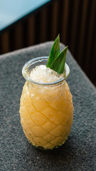 Pineapple cocktail served in a pineapple shaped glass