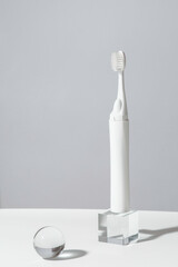 Modern rechargeable sonic or electric toothbrush with copy space