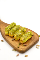 Pistachio eclair cake. Eclair cake with pistachio filling on a white background. close up