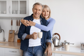 portrait of romantic senior couple drinking coffee
