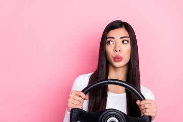 Photo of think young brunette lady drive car look promo wear white shirt isolated on pink color background