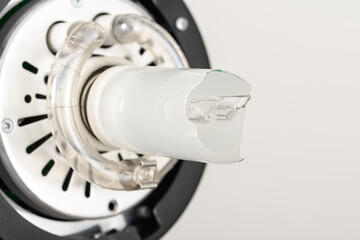 a broken modeling light bulb in a studio flash. Horizontal photo