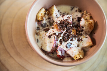 Delicious and healthy smoothie bowl on rustic wooden background.